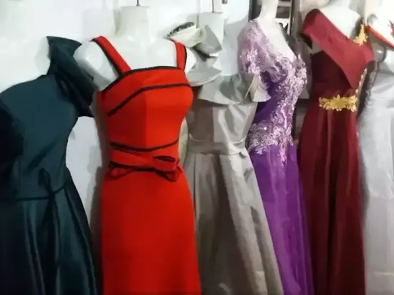 Row of elegant, embroidered dresses