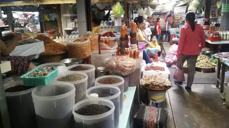 Baskets of Kampot pepper and dried spices for sale
